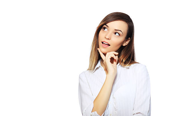 woman thinking Asian woman thinking in looking pensive and happy in casual clothes isolated on white background skeptical look stock pictures, royalty-free photos & images