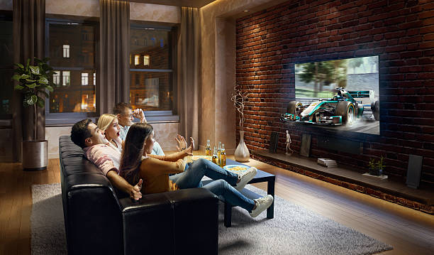 istock Couples watching Car sprint at home 629584940
