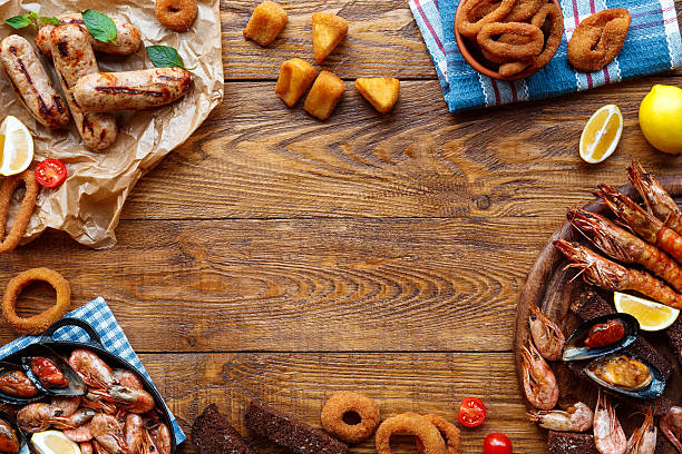 istock Seafood platter top view, flat lay on wooden table background 629585434