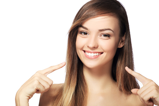 picture of beautiful woman pointing to teeth