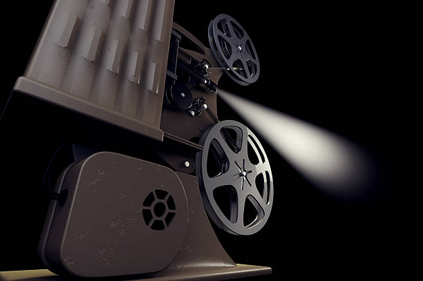 istock Retro film projector with light beam on black 629585654