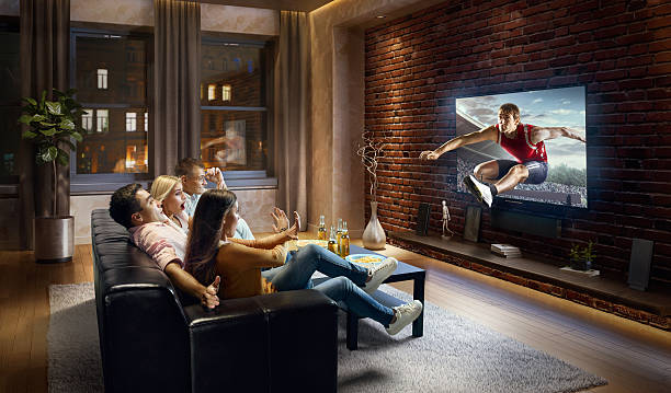 istock Couples watching very realistic Hurdling sport on TV 629585980