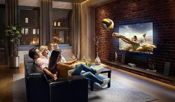 istock Couples watching Volleyball game at home 629586194