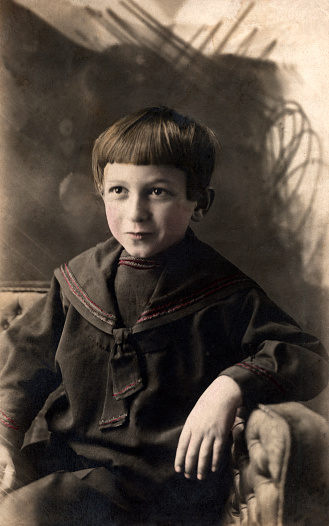Vintage portrait of a russian boy. The shot was taken around 1912 year.