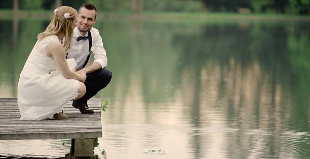 istock Bride and groom sitting 629587142