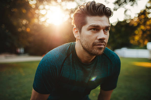 istock Healthy young man standing outdoors in park 629591998
