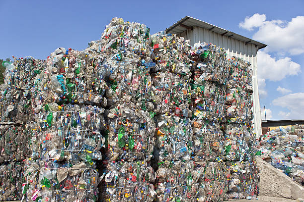 istock Stack of plastic bottles for recycling against blue sky 629592554