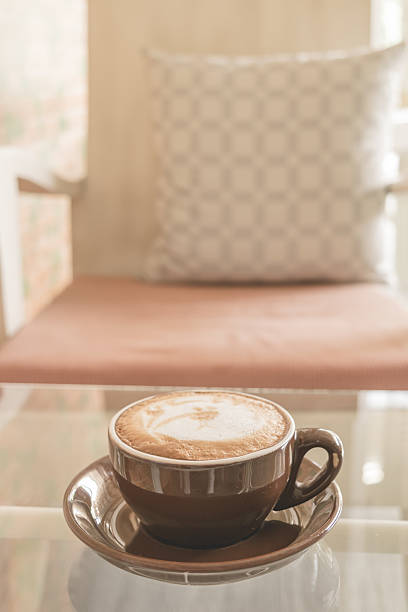 istock cup of coffee latte on the table in coffee shop 629593438