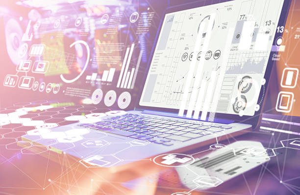 istock Double Exposure. Laptop with financial statistics on a desktop 629593774