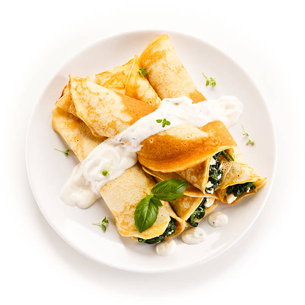 Crepes with spinach and cream