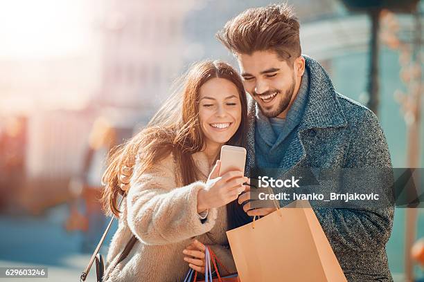 Couple In Shopping Stock Photo - Download Image Now - Couple - Relationship, Retail, Shopping