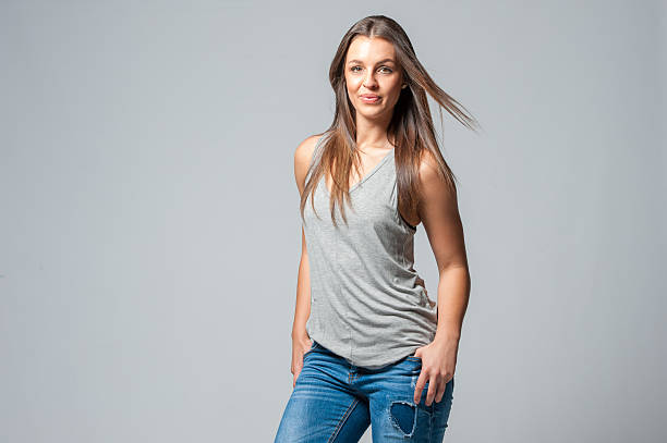 istock brunette femal on a grey background 629610992