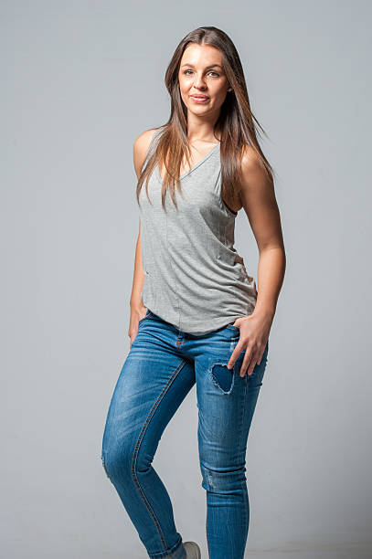 istock brunette femal on a grey background 629611116