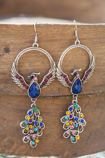 istock Peacock earrings with colorful beads 629612154
