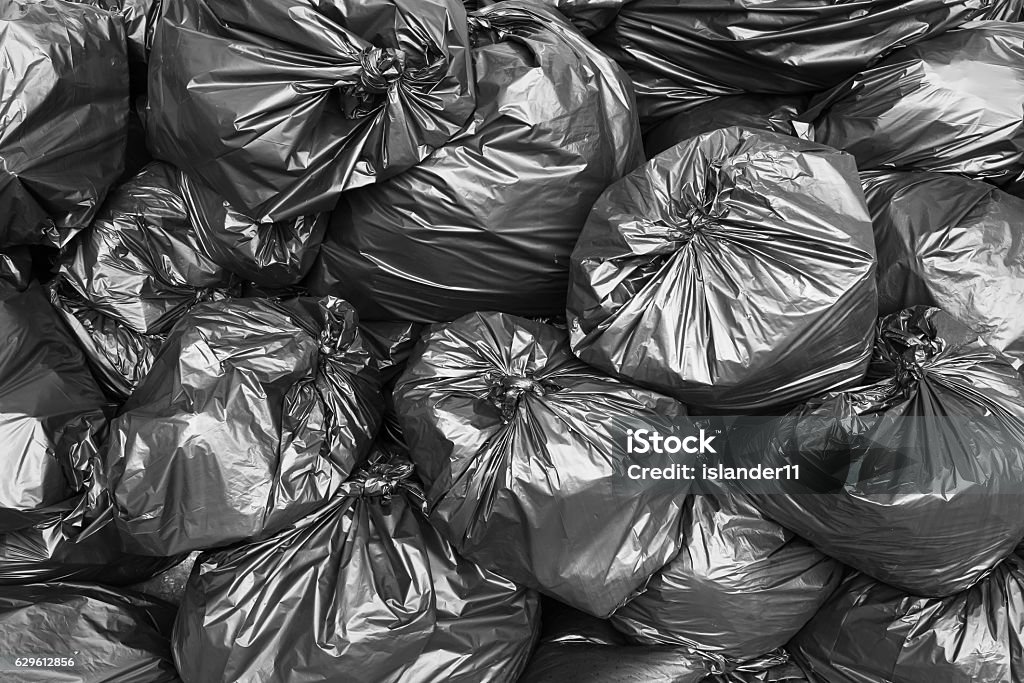 A pile of black garbage bags. Garbage Stock Photo