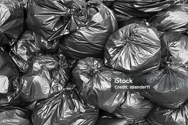 A Pile Of Black Garbage Bags Stock Photo - Download Image Now - Garbage, Garbage Bag, Bag