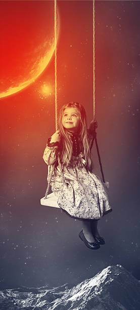 istock Little girl riding on swing. Space background 629614184