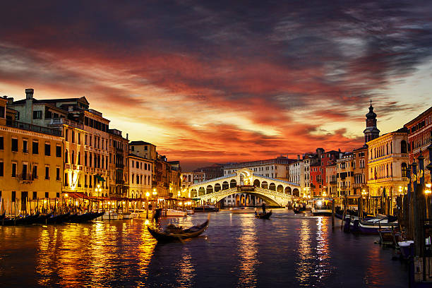 Venice at sunset Ponte Rialto and gondola at sunset in Venice, Italy venice stock pictures, royalty-free photos & images