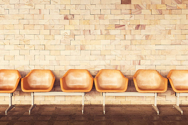 istock Old chairs with yellow brick wall background. 629617274