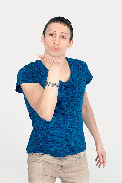 istock Handsome man doing different expressions in different sets of clothes: kiss 629617372