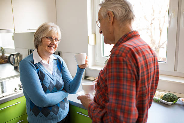 istock Affectionate senior couple enjoying their coffee at home 629626956