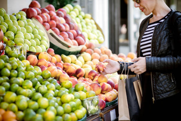 istock young woman buying vegetables 629627234