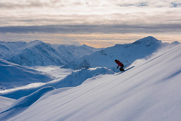 istock Female athlete making a powder turn 629627834