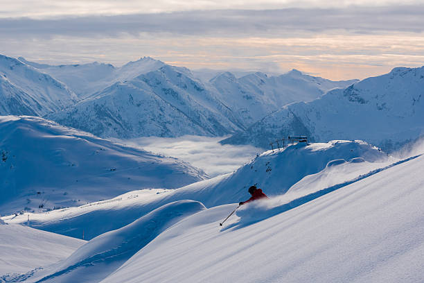 istock Female athlete making a powder turn 629627978