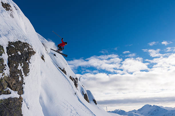 istock Female athlete jumping off a cliff 629628200