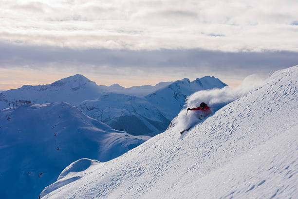 istock Female athlete making a powder turn 629628348