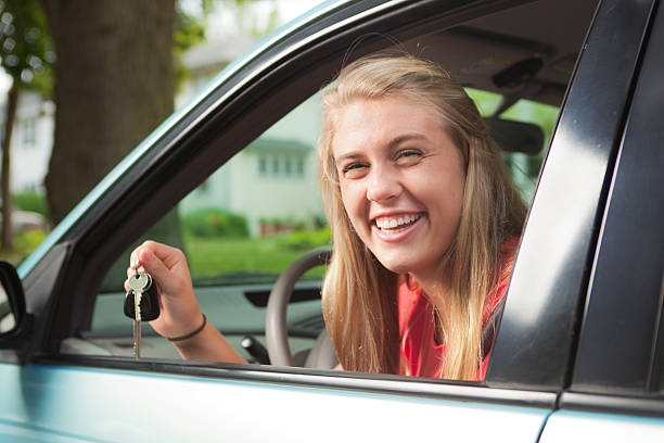 istock Happy Young Driver with Key to New Car 629628884