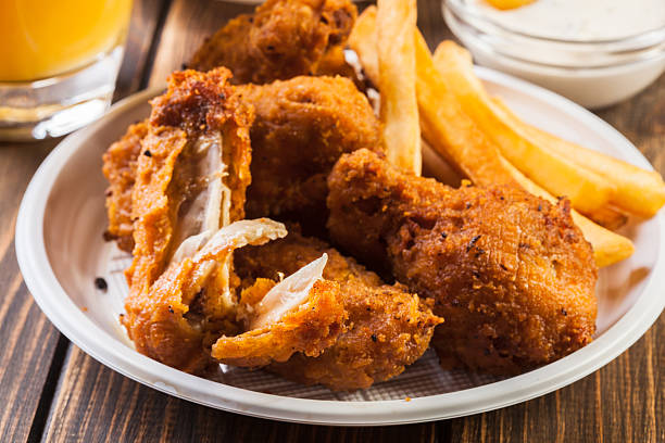 istock Crisp crunchy chicken wings with chips 629639774
