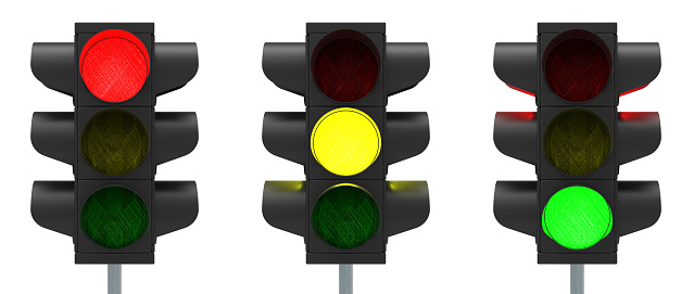 Traffic lights red, yellow and green isolated over white background 3D rendering