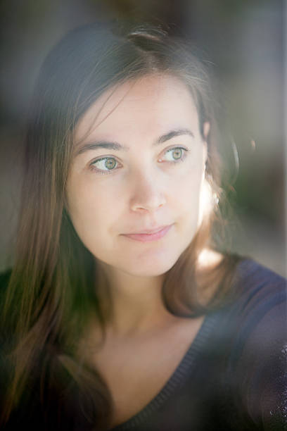 istock Young Woman Looking Out from the Window 629641068