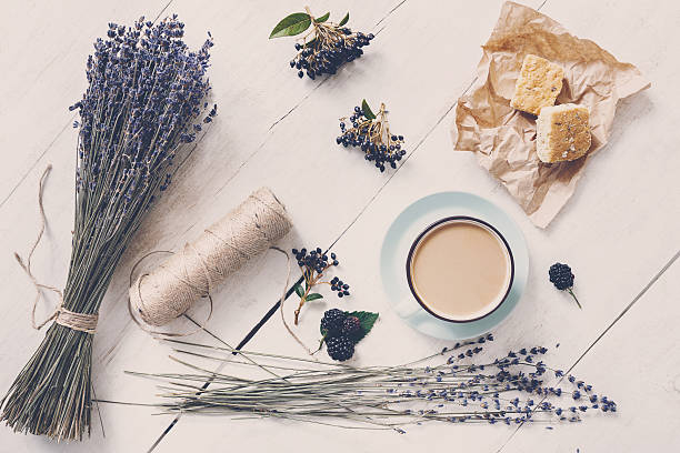 istock Latte coffee and lavender flowers composition on white wood 629641646
