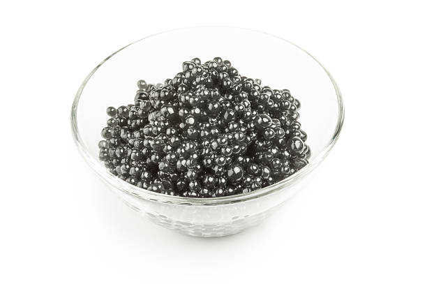 istock Black caviar, luxurious delicacy isolated on a white background 629642336