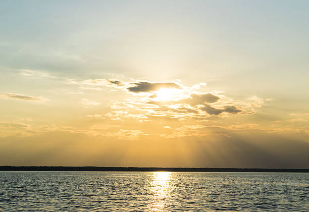 istock beautiful sunset through the  clouds over the sea 629642616