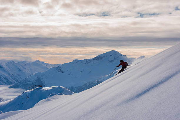 istock Female athlete making a powder turn 629652726