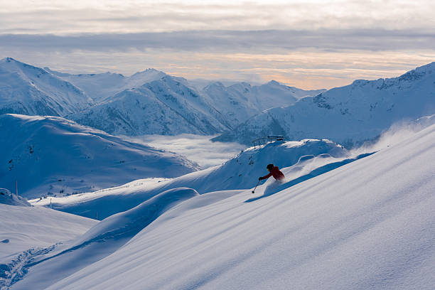 Female athlete making a powder turn