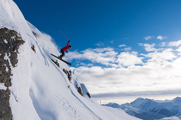 istock Female athlete jumping off a cliff 629653018