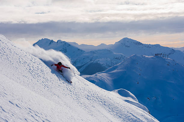 istock Female athlete making a powder turn 629653198