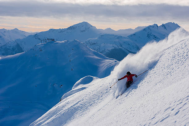 istock Female athlete making a powder turn 629653368