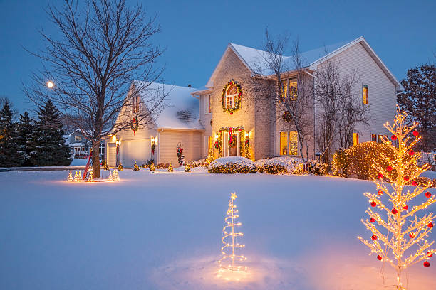istock Sparkling holiday decorated home at evening with Christmas lighting, snow 629653748