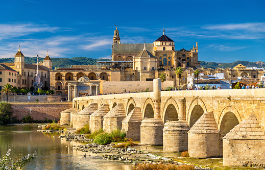 The Roman Bridge across the Guadalquivir river and the Mosque-Cathedral in Cordoba, Spain