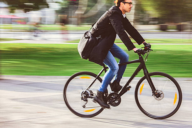 istock Handsome man riding bicycle on the way to work 629664592