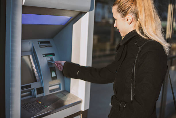 istock Young woman take money by using a cash machine , ATM 629665720