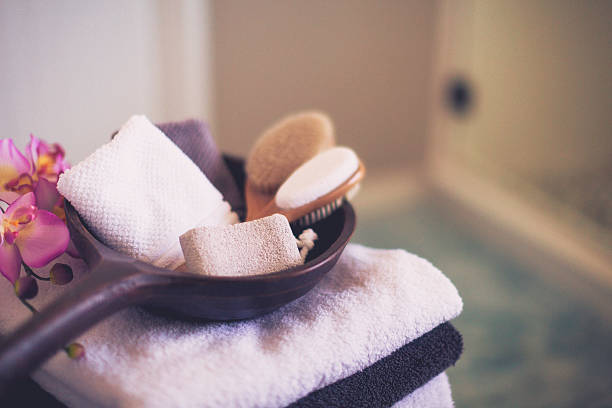 Freshly laundered towels folded neatly with spa body care essentials