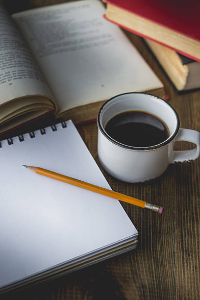 istock coffee in old cup on wooden and the book 629680662