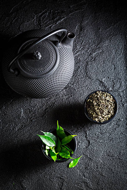 fresh green tea in asian restaurant on black rock - drinking tea cup drink imagens e fotografias de stock