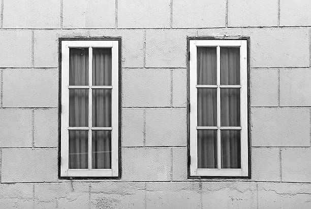 istock Windows at the concrete wall in black and white tone 629687554